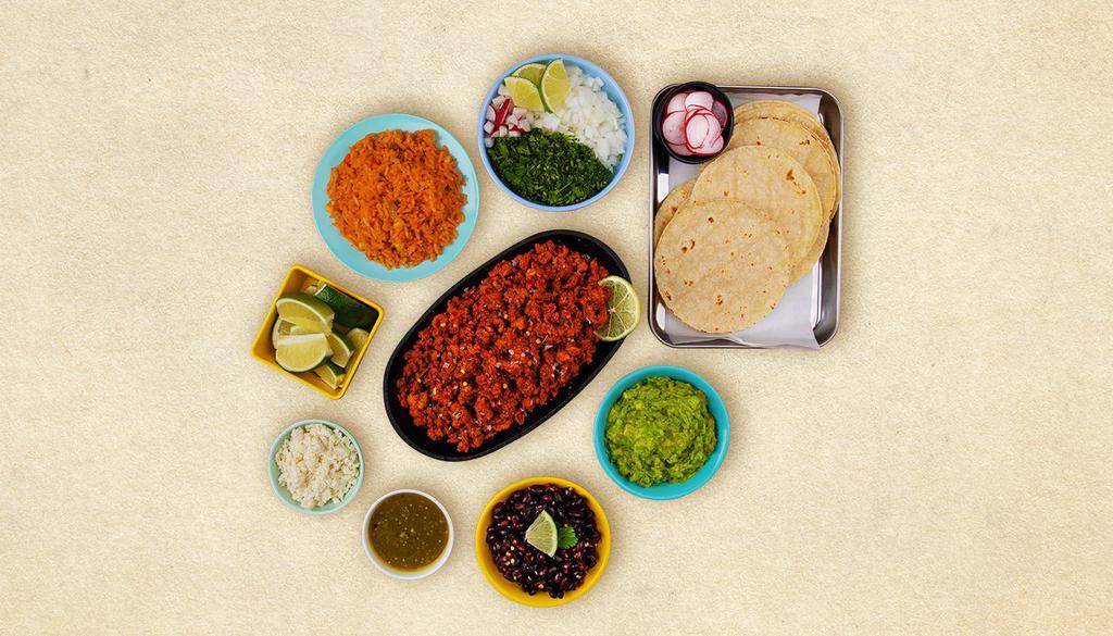Chorizo Taco Kit · 1 pound of protein, 12 hand-made corn tortillas, mexican rice, chopped onions, cilantro, shredded cheese, salsa verde, limes.