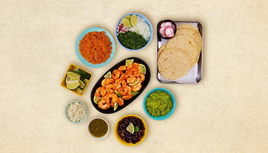 Grilled Shrimp Taco Kit · 1 pound of protein, 12 hand-made corn tortillas, mexican rice, chopped onions, cilantro, shredded cheese, salsa verde, limes.