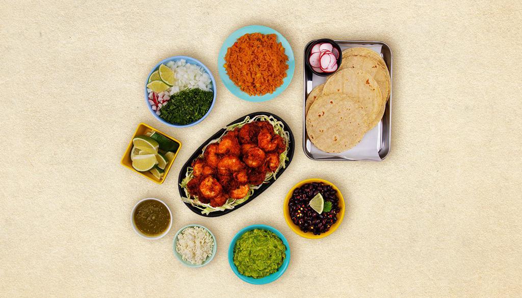 Baja Shrimp Taco Kit · 1 pound of protein, 12 hand-made corn tortillas, mexican rice, chopped onions, cilantro, shredded cheese, salsa verde, limes.