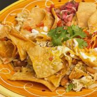 Chicken Nachos · Classic chicken nachos with melted cheese, pico de gallo, beans, and your choice of toppings.