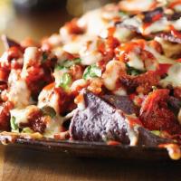 Al Pastor Nachos · Classic al pastor nachos with melted cheese, pico de gallo, beans, and your choice of toppin...