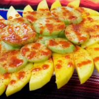 Fruta Fresca · Suculentas rebanadas de pepino y mango fresco, con un ligero toque de sal, chile en polvo y ...