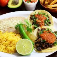 Taco Combo Doble · Two tacos filled with your meat choice, onion, cilantro, salsa a side of rice and refried be...