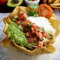 Taco Salad · Hardshell tortilla bowl, filled with your favorite meat choice refried beans, rice, cheese, ...
