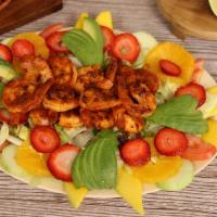 Ensalada de Camaron · 10 savory grilled jumbo shrimps, served on top of salad, avocado, cucumber, mango and strawb...