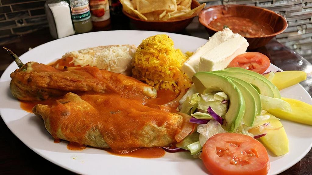 Chile Relleno  · One fresh poblano green peppers stuffed with fresh cheese, topped with homemade tomato sauce, served with salad, rice, and refried beans.