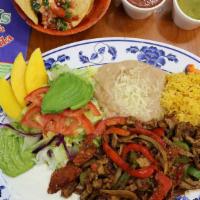 Fajitas de Res · Delicious thin beef strips slightly spiced and cooked with red and green bell pepper, onion ...