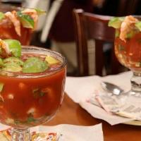 Cocktail de Camaron · tasty shrimp, with small pieces of avocado, cucumber, onion, cilantro, and tomato sauce, ser...
