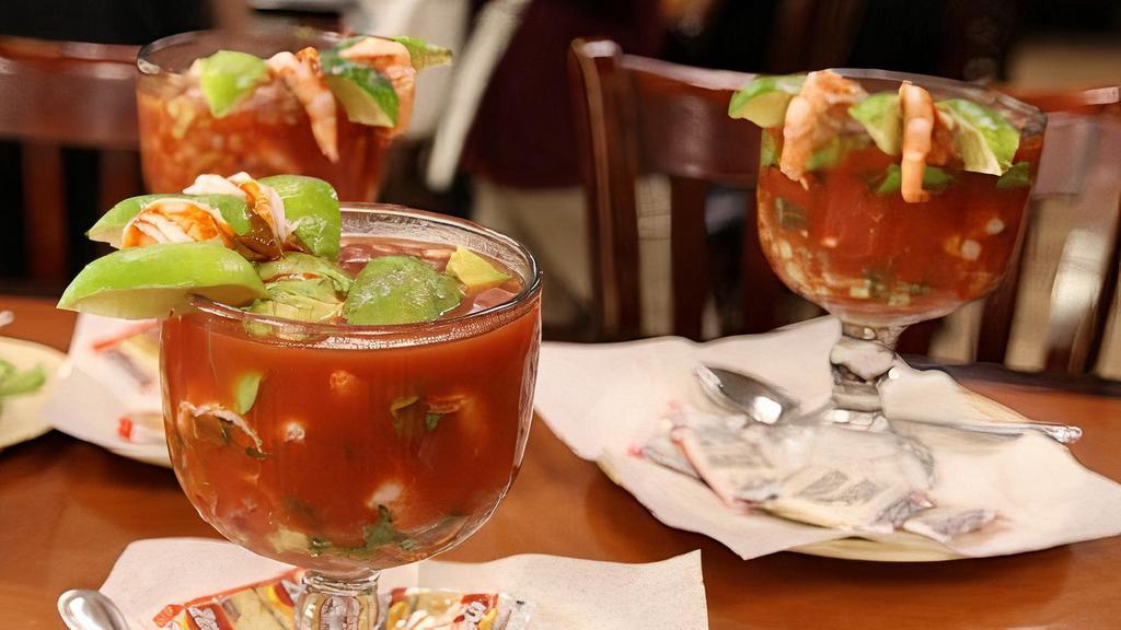 Cocktail de Camaron · tasty shrimp, with small pieces of avocado, cucumber, onion, cilantro, and tomato sauce, served with cracker cookies and/or hard tortilla. Add additional items for additional charges.