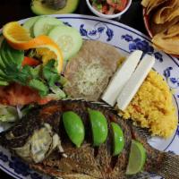 Mojarra Frita · whole mojarra fish ungutted, slightly spiced, and slowly fried till crispiness, served with ...