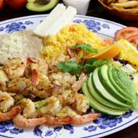 Camarones Al Mojo De Ajó · Fresh shrimp sauteed with garlic and salt served with salad, rice, refried beans, cheese, an...