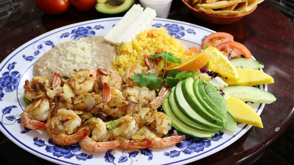 Camarones Al Mojo De Ajó · Fresh shrimp sauteed with garlic and salt served with salad, rice, refried beans, cheese, and fresh guacamole.