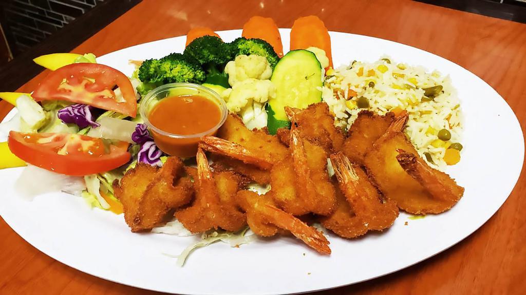 Camarones Empanizados · Shrimps dredged in breadcrumbs fried to crispiness, steam veggies, white rice, salad, and avocado.