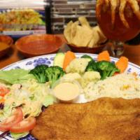Filete Empanizado · Fish fillet dredged in breadcrumbs fried to crispiness, steam veggies, white rice, salad, an...