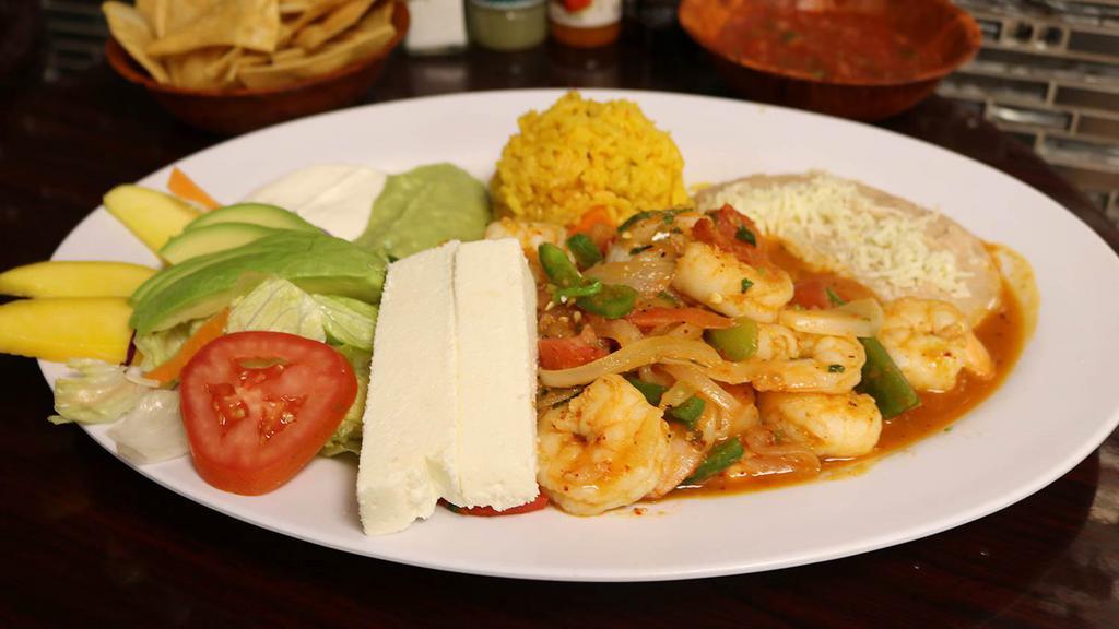 Camarones Rancheros · Delicious jumbo shrimp grilled with fresh jalapeño, onion and tomato served with salad, rice and refried beans, fresh guacamole and sour cream.