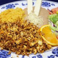 Huevos con Chorizo · Eggs and ham, three eggs scrambled with chopped chorizo, served with rice and refried beans ...