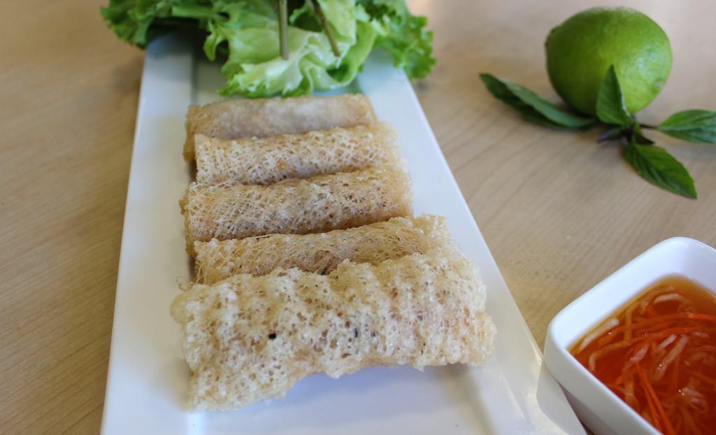 A8. Green Lotus Egg Roll · Chả giò r. Vegan. Deep fried egg rolls with special wrap, lettuce and herbs served with fish sauce.