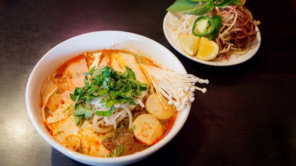 N2. Spicy Noodle Soup · Bún hu. Vegan. Spicy. Spicy rice noodle soup with beef, ham, tofu and mushroom.