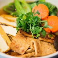 N4. Eastern Duck Style Noodle Soup · Mì tiềm. Yellow egg noodle soup with duck, tofu, Yu choy, carrot and shiitake mushroom.
