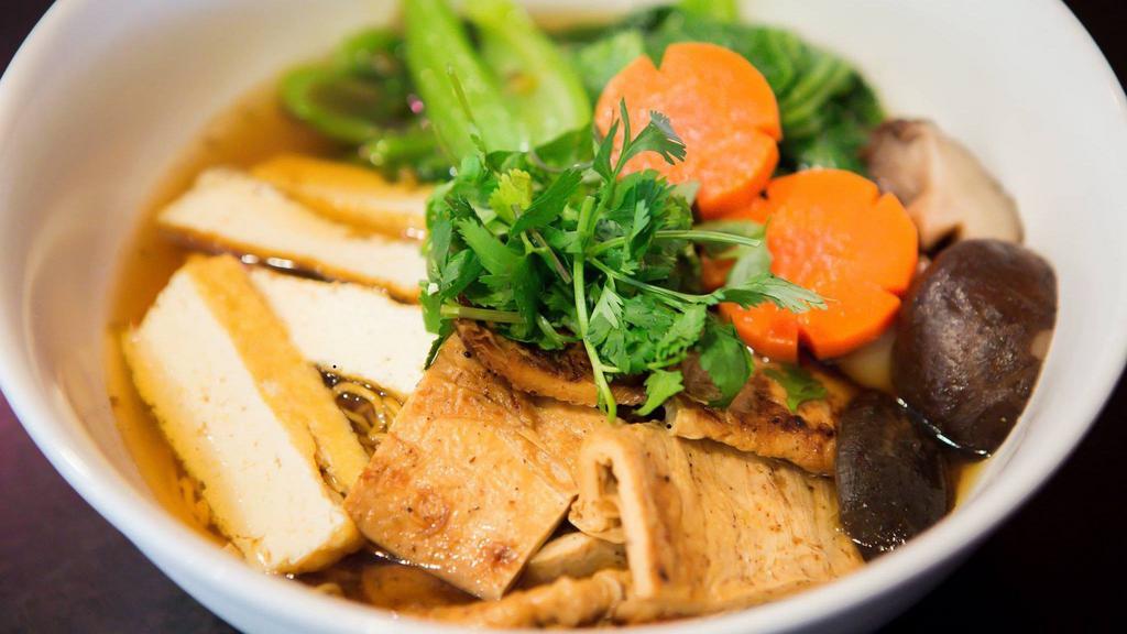 N4. Eastern Duck Style Noodle Soup · Mì tiềm. Yellow egg noodle soup with duck, tofu, Yu choy, carrot and shiitake mushroom.