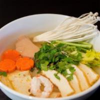 N5. House Rice Noodle Soup · Hủ tiếu green lotus. Vegan. Fresh rice noodle with carrot, broccoli, tofu and ham in savory ...