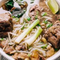 P0- Pho Duoi Bo · Beef rice noodle soup with braised Oxtail and a side of fresh herbs (includes bean sprouts, ...