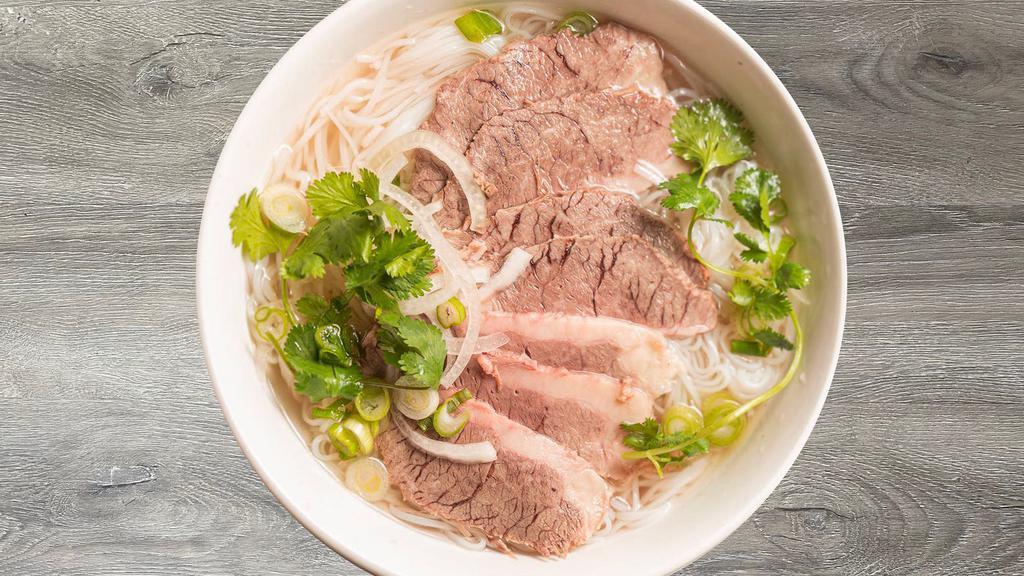 P4- Pho Chin · Beef rice noodle soup with Well-Done Lean Brisket and a side of fresh herbs (includes bean sprouts, basil, jalapeño slices, and limes).