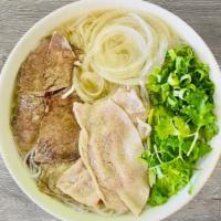 P3- Pho Tai Chin · Beef rice noodle soup with thinly sliced Rare Filet Mignon, Well-Done Lean Brisket , and a s...