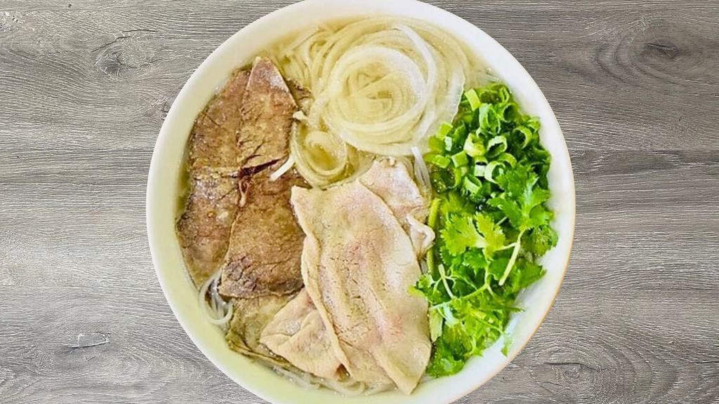 P3- Pho Tai Chin · Beef rice noodle soup with thinly sliced Rare Filet Mignon, Well-Done Lean Brisket , and a side of fresh herbs (includes bean sprouts, basil, jalepeno slices, and limes).