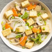 P18 - Pho Chay · Vegetable rice noodle soup with tofu, imitation meat, and side of fresh herbs.