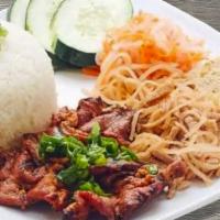 45. Com Tam Bi Cha Thit Nuong · BBQ Pork, Shredded Pork, Egg Cake over Broken Rice. Served with our famous dipping sauce.