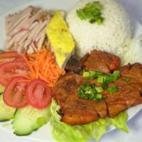 Com Tam, Suon, Bi, Cha · Grilled pork chop, julienne pork skin and meat pie. Served with lettuce, tomatoes, cucumber ...