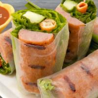 4. Nem Cuon - Roasted Pork Spring Rolls · Broiled pork wrapped in rice paper with fresh herbs and vermicelli, served with Tay Ho ‘s si...