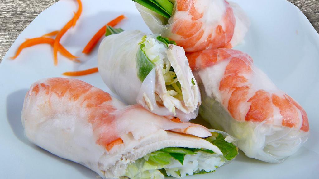 2. Goi Cuon - Fresh Shrimp Spring Rolls · Steamed shrimp and pork slices wrapped in rice paper with fresh herbs and rice noodles, served with peanut sauce. 2 rolls included.