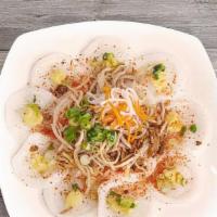 8. Banh Beo · Steamed rice cake topped with shrimp bits, mung bean and green onions, served with shredded ...