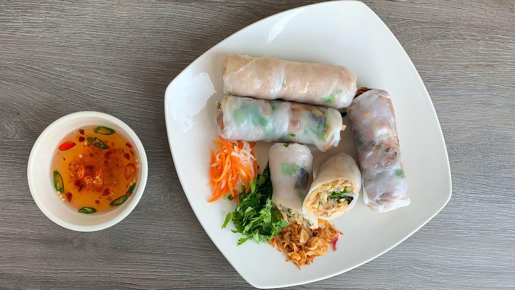 3. Bi Cuon - Shredded Pork Spring Rolls · Shredded pork wrapped in rice paper with fresh herbs and vermicelli, served with our famous house dipping sauce. 2 rolls included.