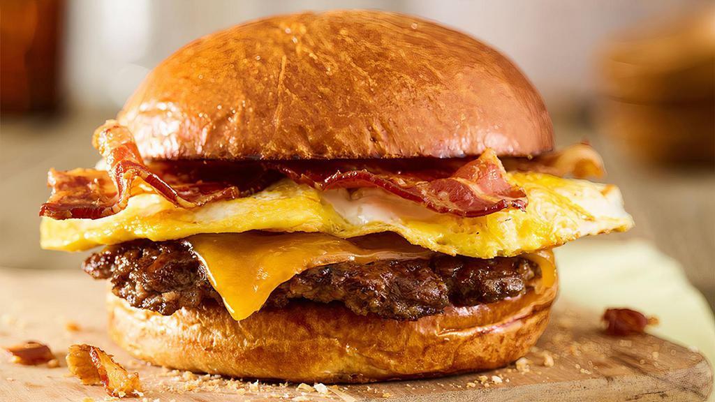 Breakfast Smashburger · Certified Angus Beef, fresh cracked egg, applewood smoked bacon, aged cheddar cheese, toasted brioche bun