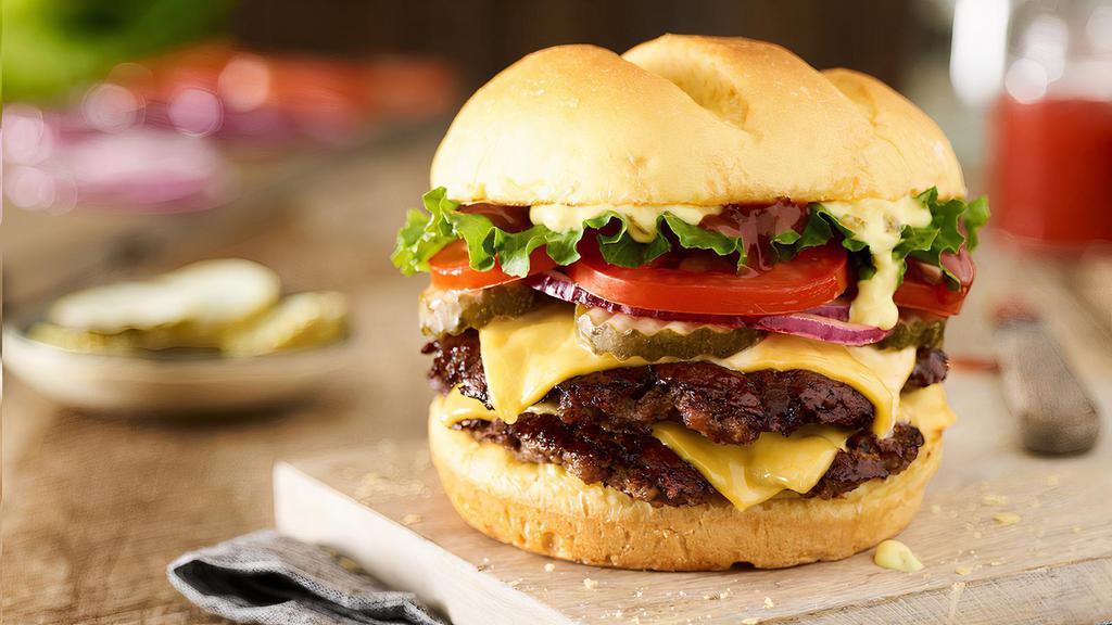 Double Classic Smash® Burger · Double Certified Angus Beef, American cheese, lettuce, tomatoes, red onions, pickles, Smash Sauce®, ketchup, toasted bun