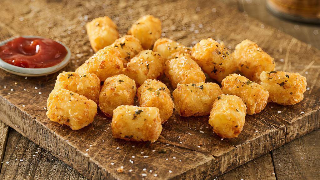 Smash Tots®  · Crispy golden brown tots tossed in rosemary, garlic, & olive oil