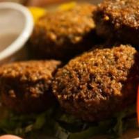 Falafel (4 Pieces) · Fried chickpea patties, spices and tahini sauce.