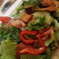 Fattoush Salad · Lettuce, tomato, cucumber, pita chips, onion, parsley, dry mint, lemon juice, olive oil and ...