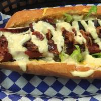 Warrior Dog · Toasted soft roll with All Beef Hot Dog  Nacho Cheese, lettuce, Pickled Red onions, Bacon to...