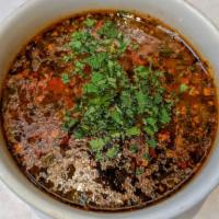 Kharcho · With a cherry plum purée base, this traditional Georgian soup brims with diced beef, rice, a...