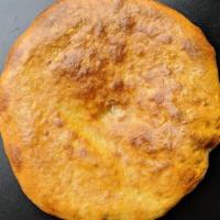 Khachapuri Imeruli · ‍Round-shaped bread with cheese inside.