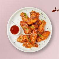 Cajun Glaze Wings · Fresh chicken wings breaded, fried until golden brown, and tossed with cajun sweet & sour sa...