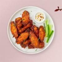 Classic Crunchy Wings · Fresh chicken wings breaded and fried until golden brown.