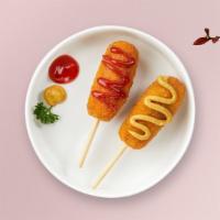 Corn Dog · Juicy hot dog dipped in cornmeal-based batter and deep fried until golden brown.