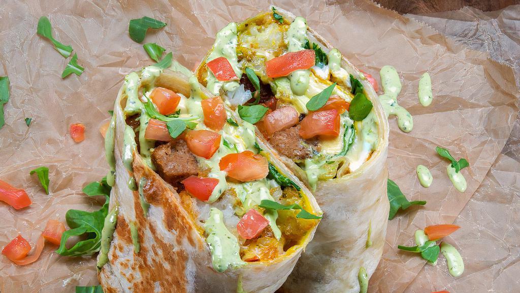 Beyond Breakfast Burrito (Vegetarian) · 3  sunny side up eggs, choice of beyond sausage, white American cheese, crispy tater tots, spicy basil aioli, avocado, arugula, tomato. Sides of spicy mayo & hot sauce.