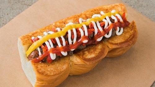 Downtown · smoked bacon dog, caramelized onions, pickled peppers, mayo, mustard, ketchup