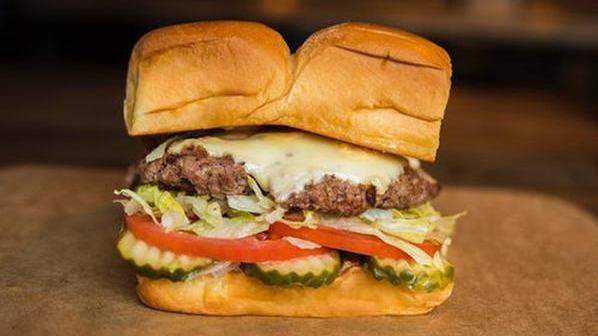 Cheeseburger · White American cheese, pickles, lettuce, tomato, onion, and secret sauce. Served on King's Hawaiian roll.